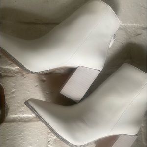 Brand new. Never worn. Steve Madden white studded booties. Size 7.5.